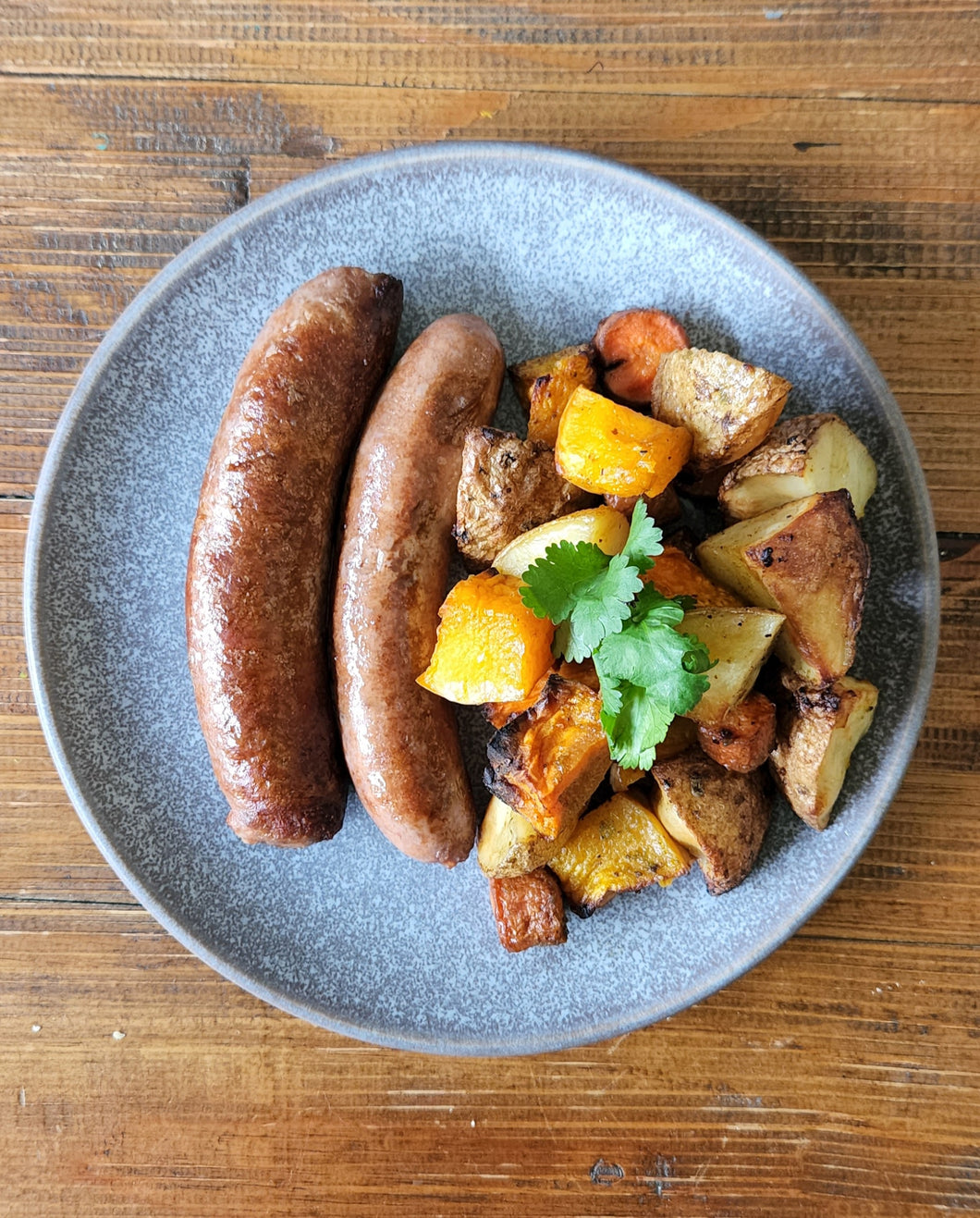 Beef brisket sausages with roasted vegetables